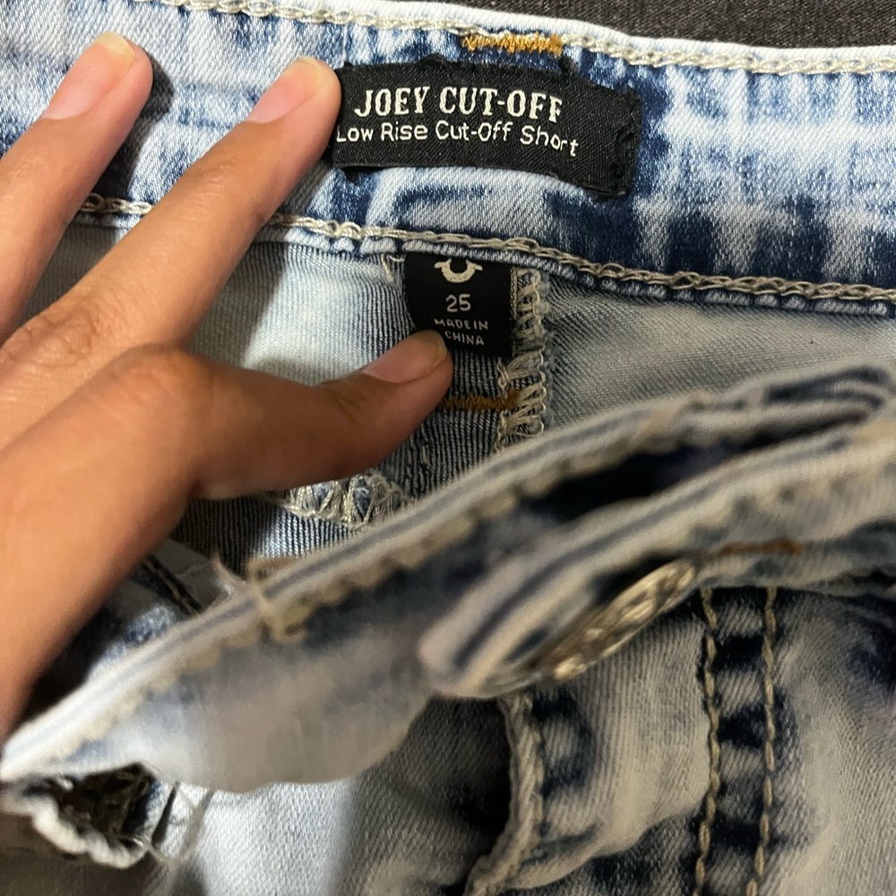True Religion blue acid wash denim shorts with a raw hem